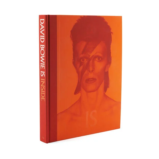Orange hardback book with an image of Ziggy Stardust on the cover