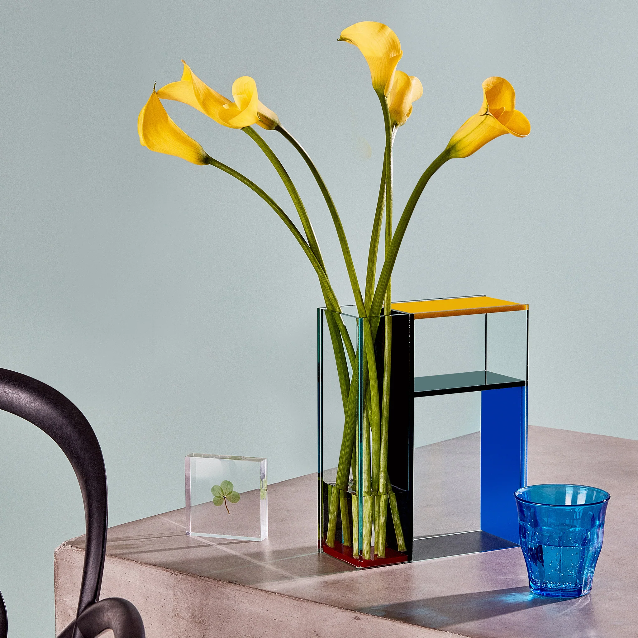 A glass vase in the style of a mondrian painting