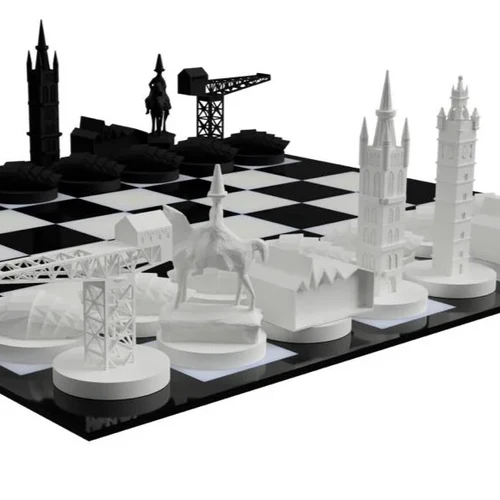 Close-up of chess pieces in the shapes of various Glasgow landmarks