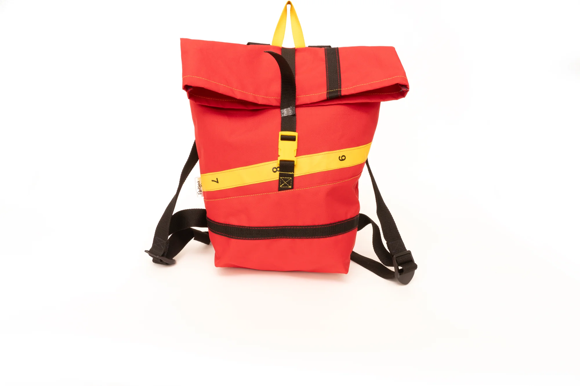 A red backpack with yello and black trim