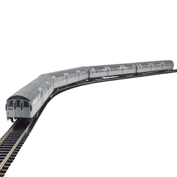 A model of an old Central line tube train running on a train set