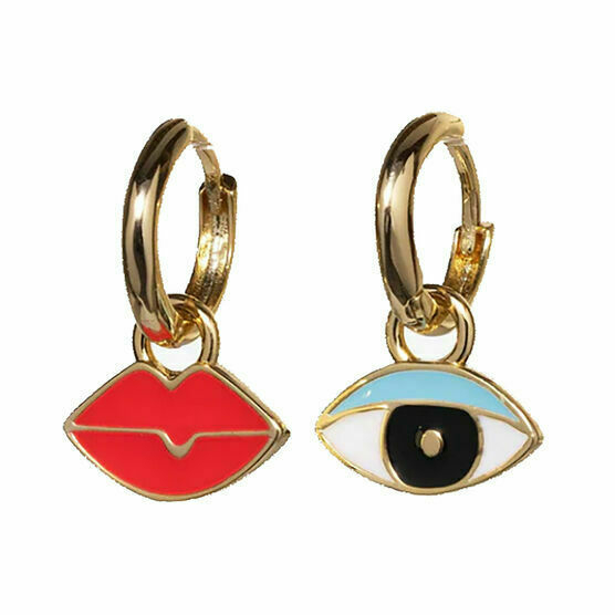 A pair of earrings. One is a stylised mouth, the other a stylised eye