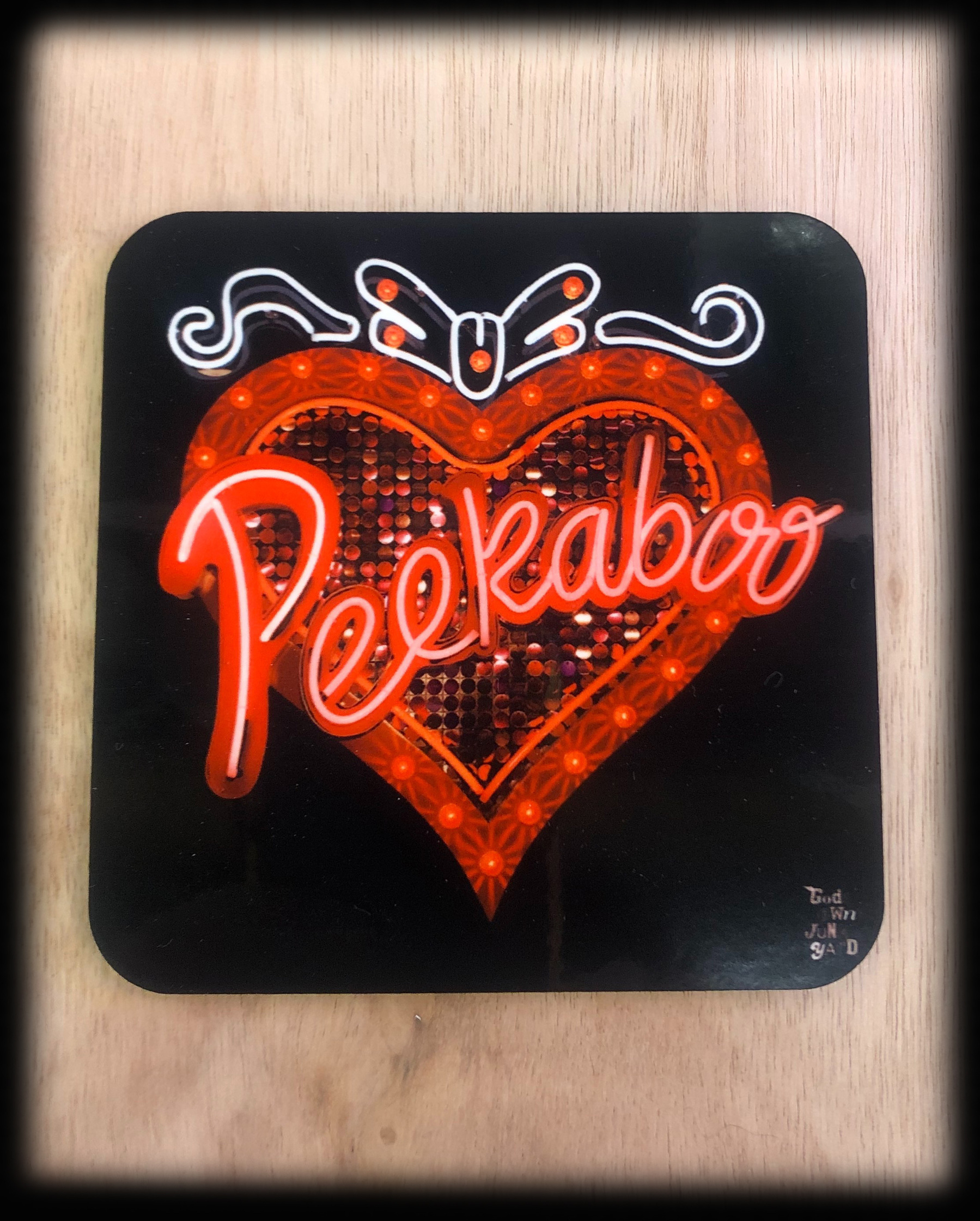 Peekaboo neon sign Coaster.