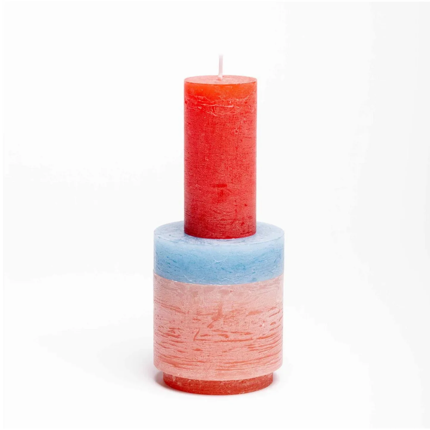 A stack of different coloured candles
